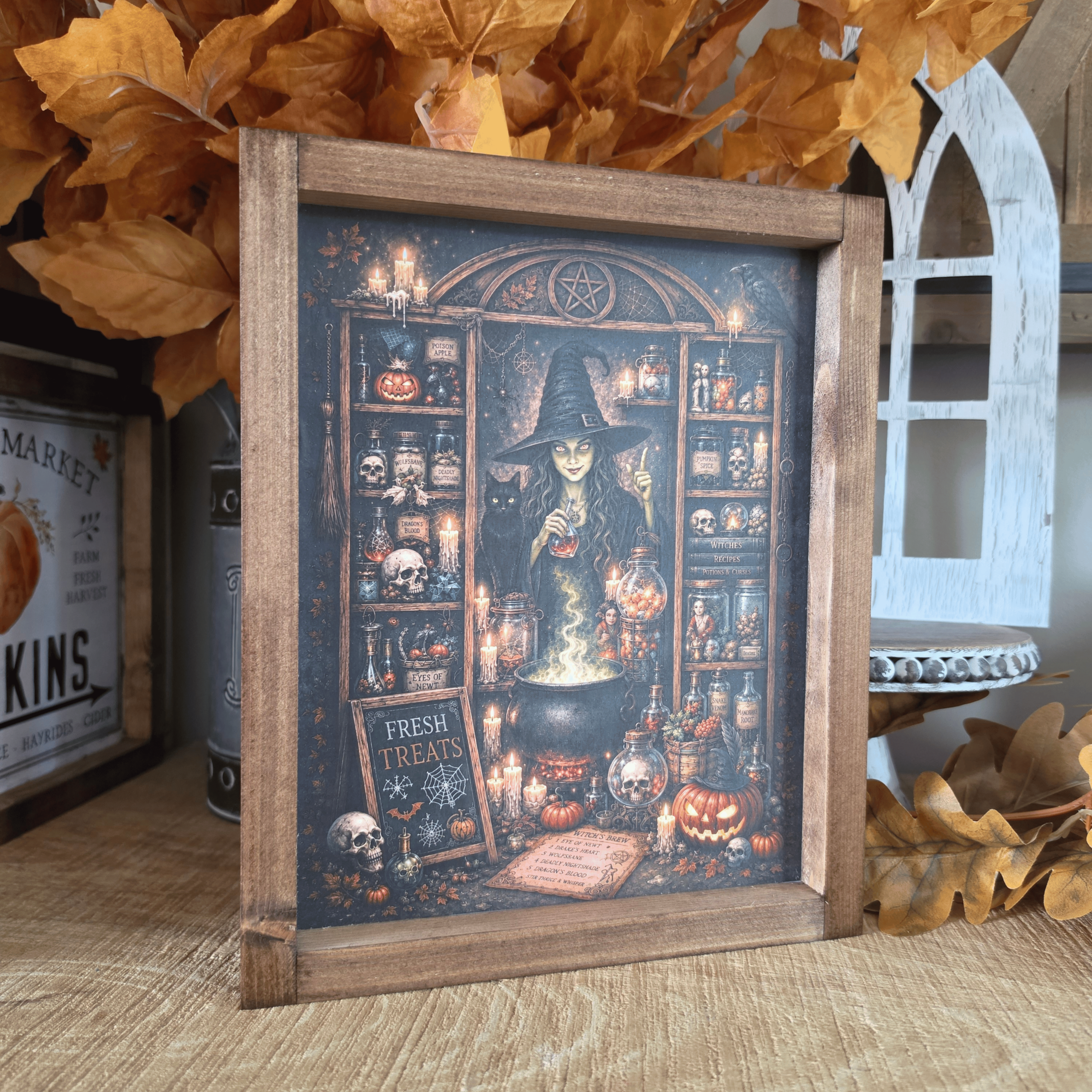 Cadre sorcière farmhouse avec chaudron, potions et chat noir