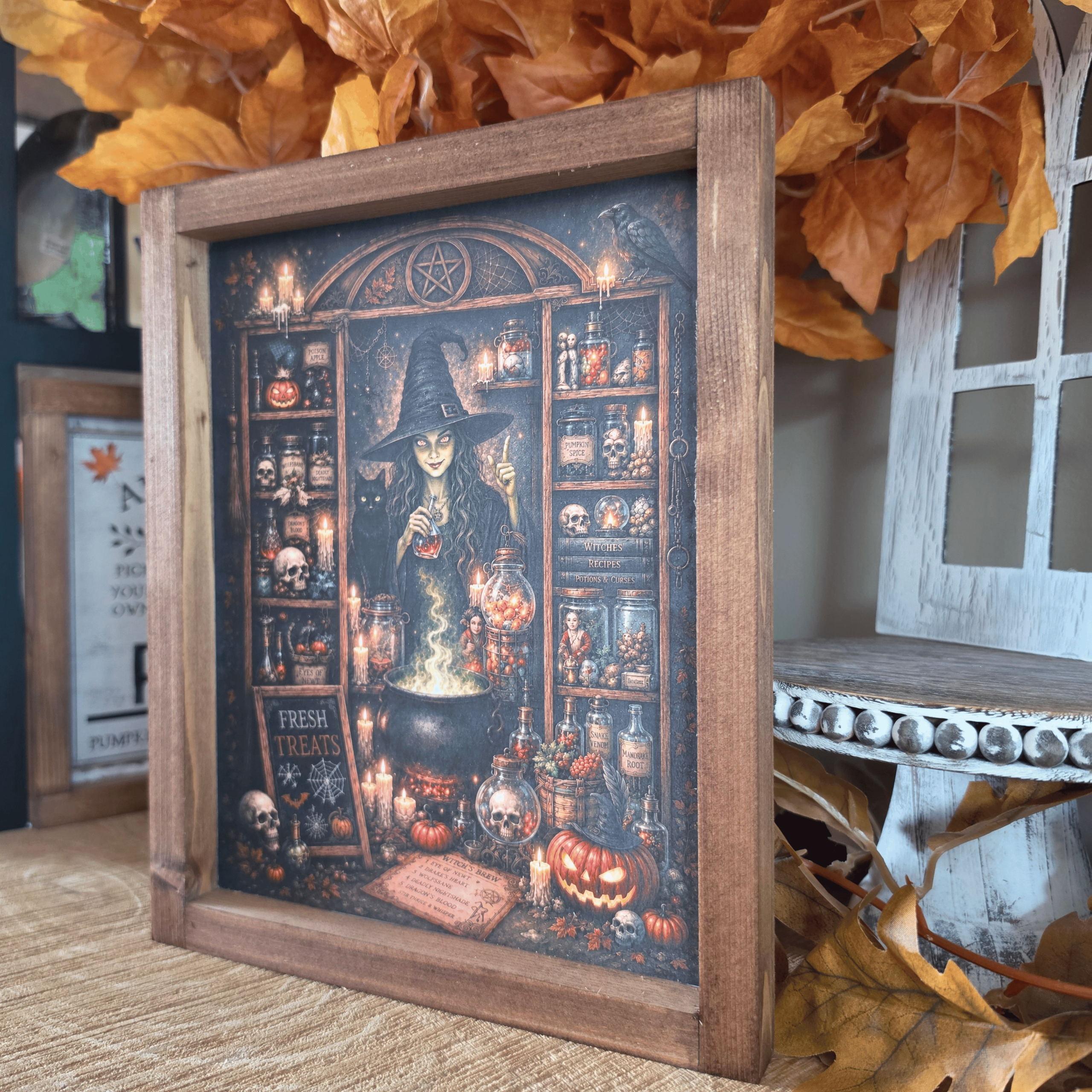Cadre sorcière farmhouse avec chaudron, potions et chat noir