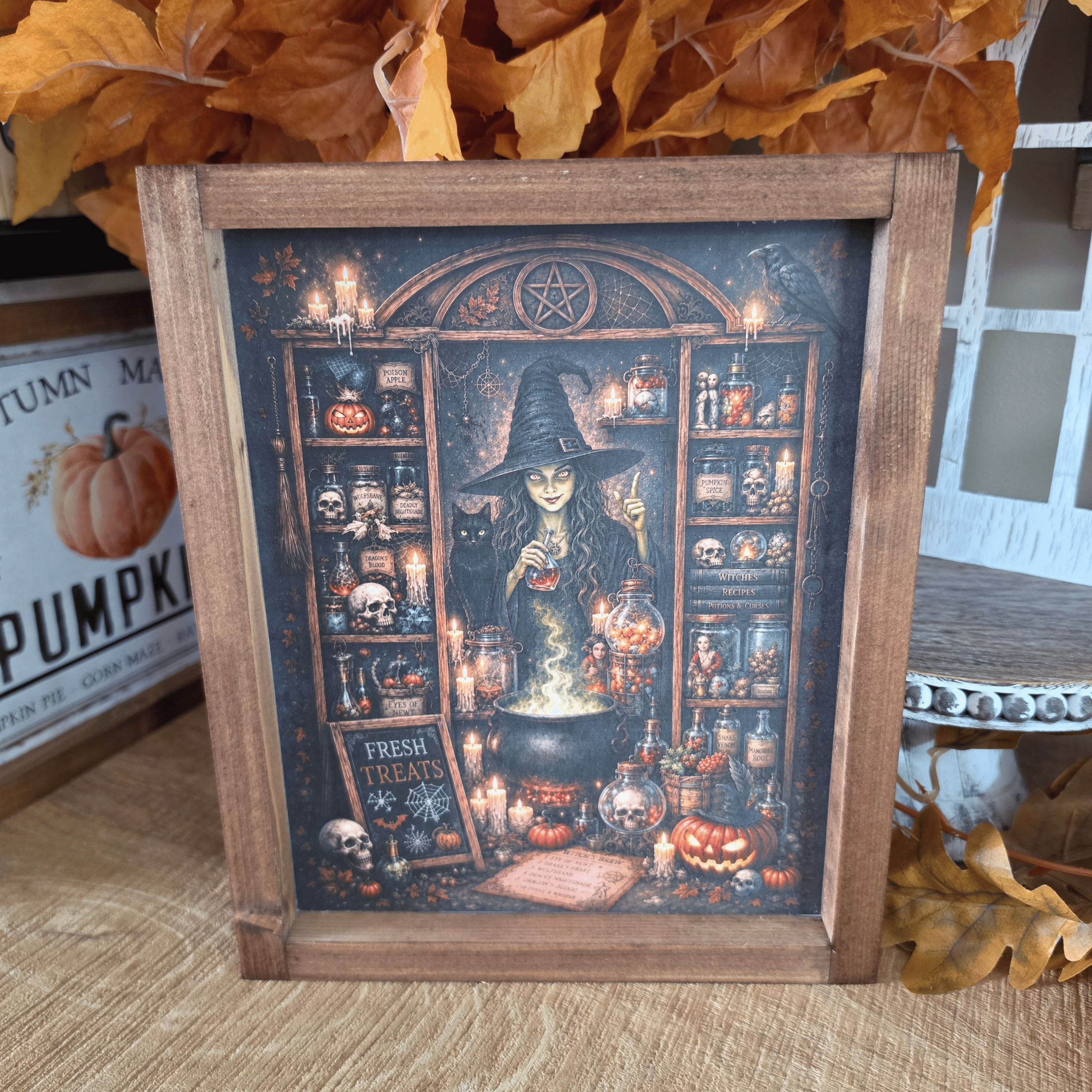 Cadre sorcière farmhouse avec chaudron, potions et chat noir