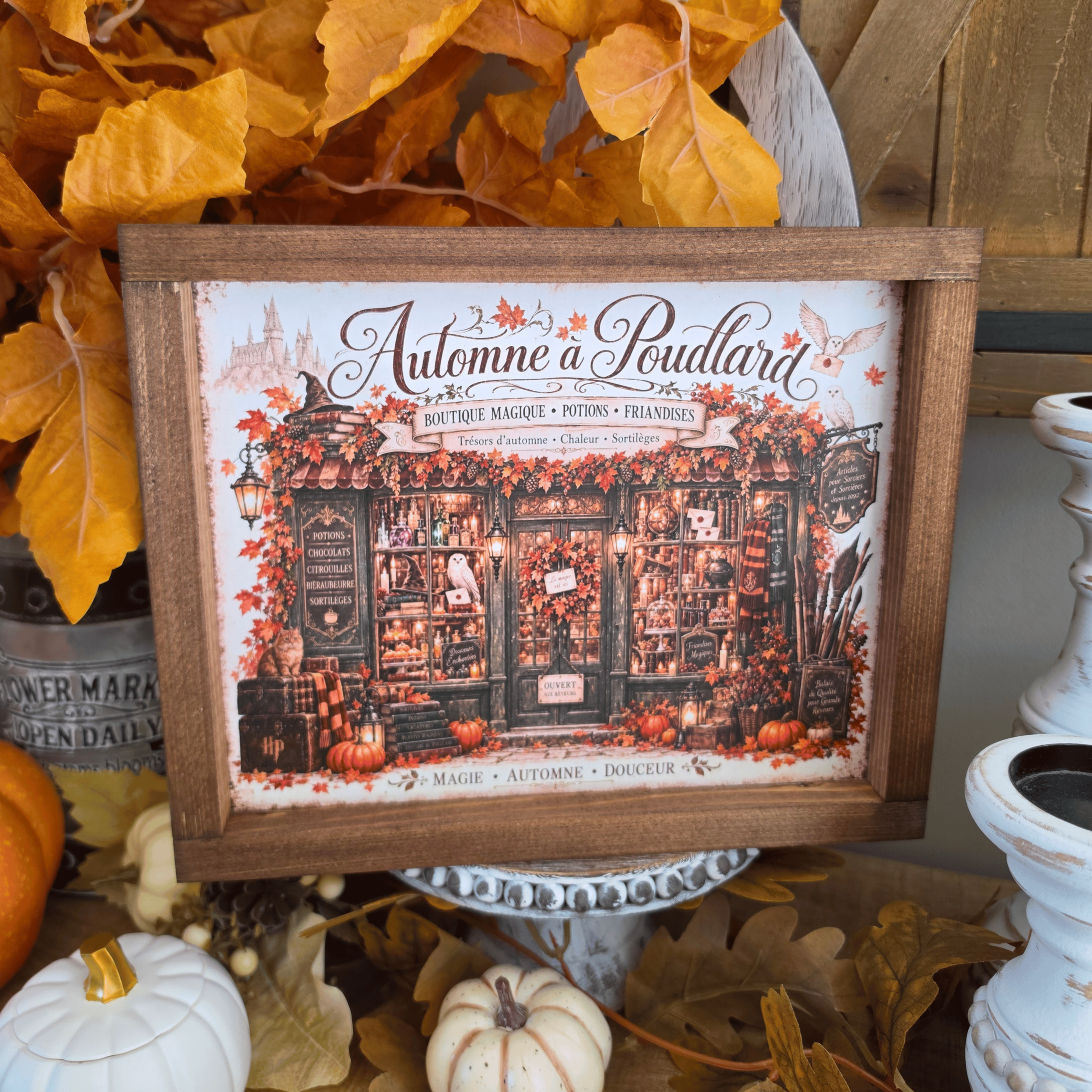 Cadre Automne à Poudlard avec boutique magique et citrouilles