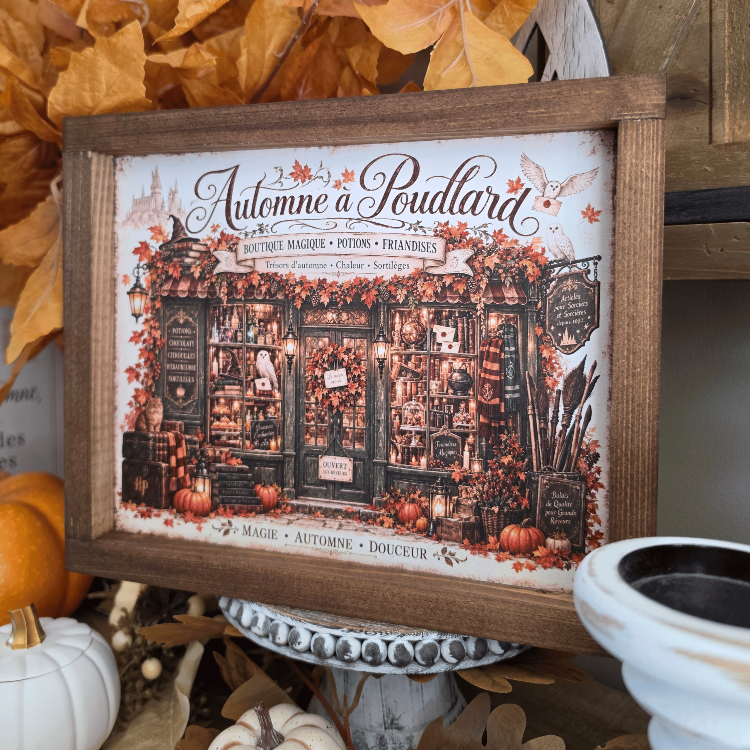 Cadre Automne à Poudlard avec boutique magique et citrouilles